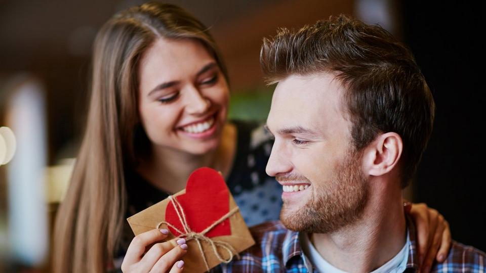 couple-smiling-giving-gifts